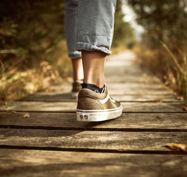 A persons feet as they walk mindfully.